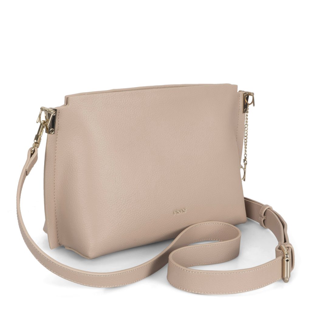 Angle view of an beige crossbody bag that is called Jade designed by Riona showing its supple faux leather texture, gold accents and a shoulder strap.
